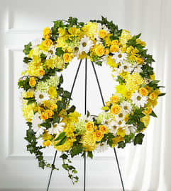 FTD Golden Remembrance Wreath. An arrangement by Fendley Florists. FTD Golden Remembrance Wreath. An arrangement by Fendley Florists.