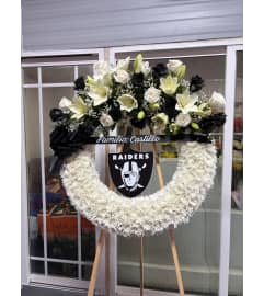 Whispering Lilies Tribute. An arrangement by JM Flowers.
