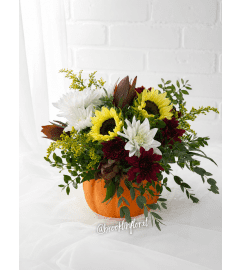 Plum and Honey Ceramic Pumpkin Centrepiece. An arrangement by Brooklin Floral and Garden Shoppe Inc..
