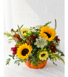 Plum and Honey Ceramic Pumpkin Centrepiece. An arrangement by Brooklin Floral and Garden Shoppe Inc..