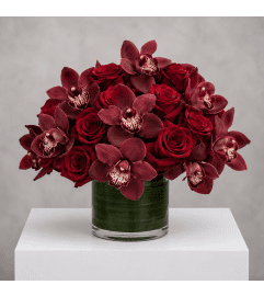 Midnight Rose Elegance. An arrangement by Bill's Flowers Arrangements. Midnight Rose Elegance. An arrangement by Bill's Flowers Arrangements.