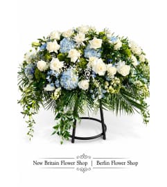 Serene Blue Casket Spray. An arrangement by Berlin Flower Shop.