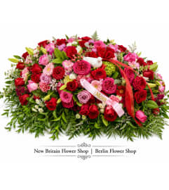Garden Elegance Casket Spray. An arrangement by Berlin Flower Shop.