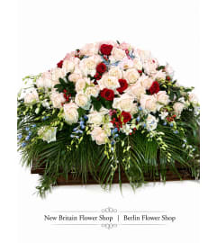 Timeless Trio Rose Casket Spray. An arrangement by Berlin Flower Shop.