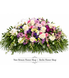 Rose Elegance Casket Spray. An arrangement by Berlin Flower Shop.