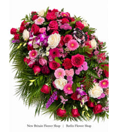 Bloom Elegance Casket Spray. An arrangement by Berlin Flower Shop.