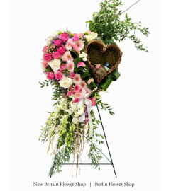 Rose Garden Wreath. An arrangement by Berlin Flower Shop.