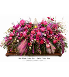 Serene Rose Casket Spray. An arrangement by New Britain Flower Shop.