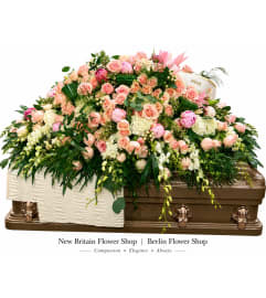 Peach Blossom Casket Spray. An arrangement by Berlin Flower Shop.