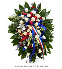 Patriotic Tribute Funeral Spray. An arrangement by Berlin Flower Shop.