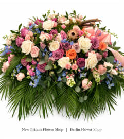 Garden of Grace Casket Spray. An arrangement by New Britain Flower Shop.