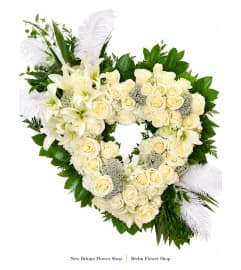 Forever in Our Hearts Floral Wreath. An arrangement by New Britain Flower Shop.