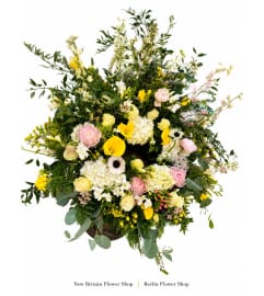 Sunlit Garden Tribute Cremation Ring. An arrangement by New Britain Flower Shop.
