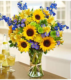 SUNFLOWER BLUE. An arrangement by Fink Flowers Gifts and Flower Delivery. SUNFLOWER BLUE. An arrangement by Fink Flowers Gifts and Flower Delivery.