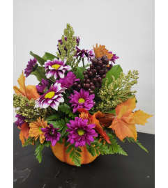 Fall pumpkin keepsake. An arrangement by Aylmer Flowers and Gifts.