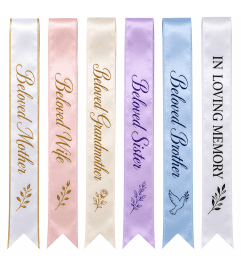SYMPATHY RIBBON. An arrangement by Tom's Florist. SYMPATHY RIBBON. An arrangement by Tom's Florist.