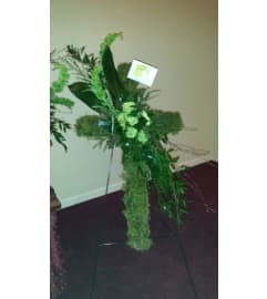 MOSSY CROSS. An arrangement by Gary's Floral Gallery.