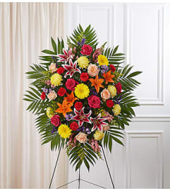 Bright Sympathy Standing Spray. An arrangement by Blessing and Blooms Florist.