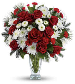 Teleflora's Winter Kisses Bouquet. An arrangement by Wasaga Flowers.