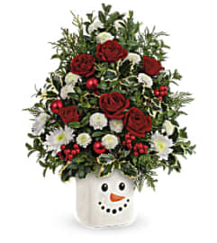 Teleflora's Snowy Surprise Bouquet. An arrangement by Marivel's Florist and Gifts.