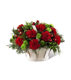 The FTD® Winter Wishes™ Basket. An arrangement by Travis Floral Shop.