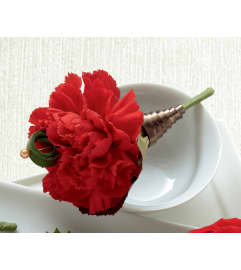 The FTD® Red Carnation Boutonniere. An arrangement by Mystic Garden Floral.