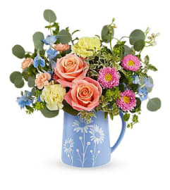 The Teleflora's Daisy Dreams Bouquet. An arrangement by Marivel's Florist and Gifts.