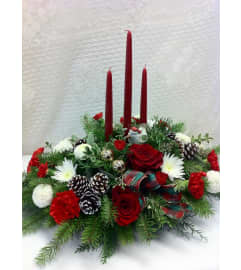elegant 3 Candle Centerpiece. An arrangement by Nicol Florist.