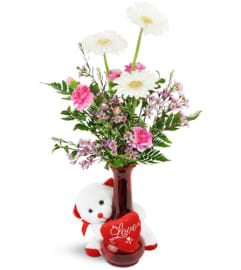 Darling Daisies™ with Love Bear. An arrangement by The Flower Shop.