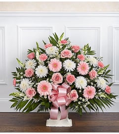 Heartfelt Tribute Pink and White Floor Basket. An arrangement by Graceland Florist.