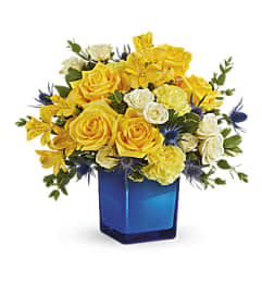 Teleflora's Golden Blue Bouquet. An arrangement by Marivel's Florist and Gifts.