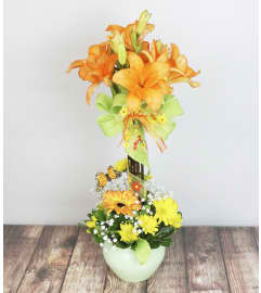 Jeweled Peach. An arrangement by Pike Creek Flower and Gift Shoppe.