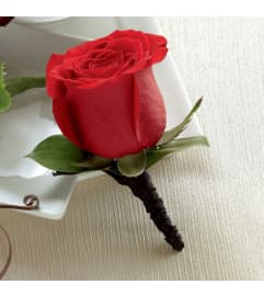 The FTD® Red Rose Boutonniere. An arrangement by Royal Louis Florist.