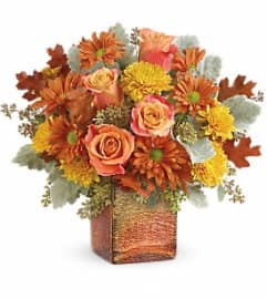 Teleflora's Grateful Golden Bouquet. An arrangement by White's Flowers.