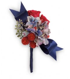 Camera Ready Boutonniere. An arrangement by Devine Orchid.