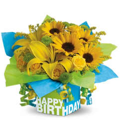 Teleflora's Sunny Birthday Present. An arrangement by Pompano Beach Floral.