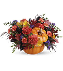 Teleflora's Hauntingly Pretty Pumpkin Bouquet. An arrangement by Burlington Florist.