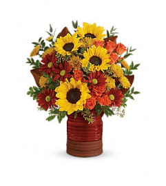 Teleflora's Sunshine Crock Bouquet. An arrangement by Fabulous Flowers.