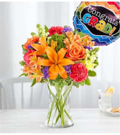 Vibrant Floral Medley™ for Graduation. An arrangement by Lovingly.