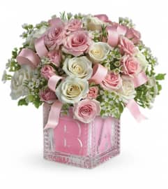 Baby's First Block by Teleflora - Pink. An arrangement by Pompano Beach Floral.