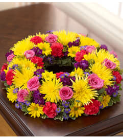 Cremation Wreath - Multicolor Bright. An arrangement by Graceland Florist.