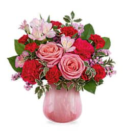 The Teleflora's Sweet On Hue Bouquet. An arrangement by Marivel's Florist and Gifts.