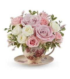 The Teleflora's Blossoming Petals Bouquet. An arrangement by Marivel's Florist and Gifts.