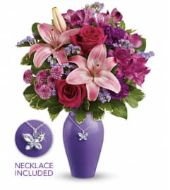 Teleflora's Beautiful Butterfly Bouquet. An arrangement by Devine Orchid.