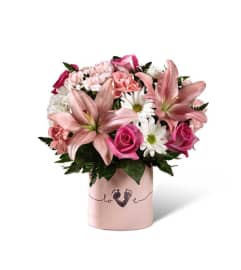 The FTD® Tiny Miracle™ New Baby Girl Bouquet. An arrangement by Believe Flowers.
