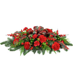 Christmas Traditions Centerpiece™. An arrangement by The Flower Shop.