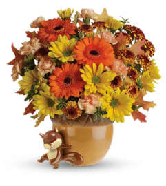 Teleflora's Send a Hug™ Fetching Fall Bouquet. An arrangement by Artistic Way Flowers.
