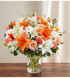 Sincerest Sorrow™ - Peach, Orange and White. An arrangement by Lovingly.