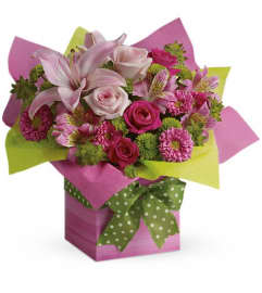 Teleflora's Pretty Pink Present. An arrangement by Pompano Beach Floral.