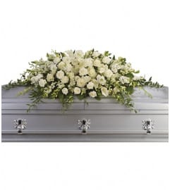 Purity and Peace Casket Spray. An arrangement by Wasaga Flowers.